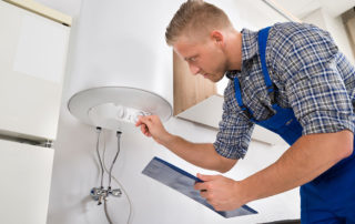 man checking water heater