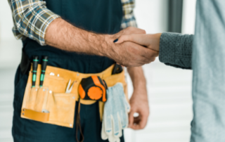 plumber shaking hands