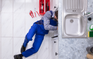 plumber fixing residential sink