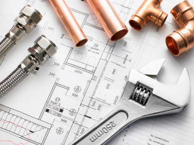 blueprints and plumbing tools